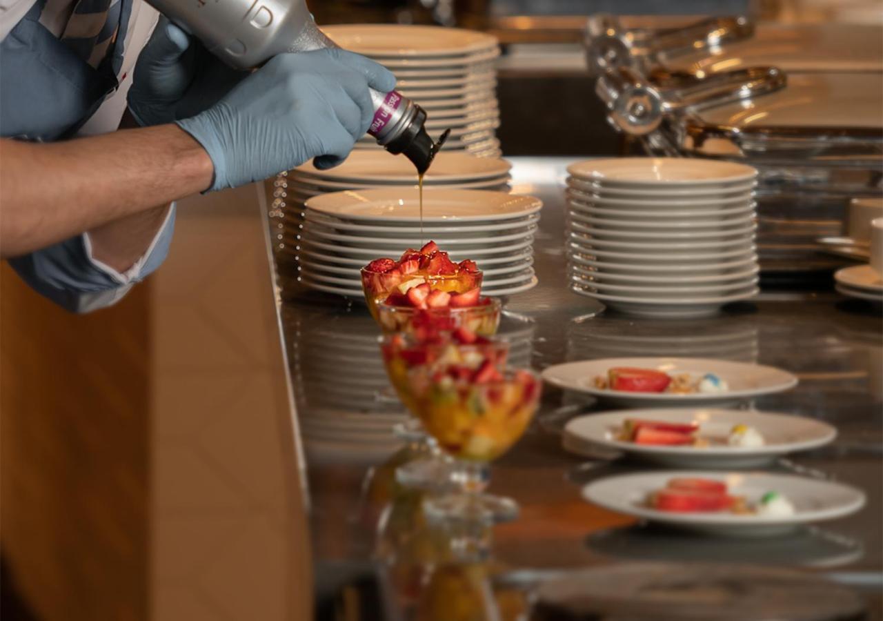 Crystal Inn Hotel - Alamein (Adults Only) El Alamein Esterno foto A pastry chef finishing a dessert